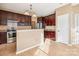 Kitchen with dark wood cabinets, stainless steel appliances, and tile floors at 8325 Springhead Ln # 48, Charlotte, NC 28215