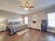 Spacious bedroom with hardwood floors and ceiling fan at 8879 Renee Ford Rd, Stanfield, NC 28163