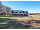 Two-story house with a front porch and a spacious lawn at 8879 Renee Ford Rd, Stanfield, NC 28163