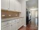 White kitchen cabinets and granite countertops at 15019 Ockeechobee Ct, Mint Hill, NC 28227