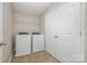 Laundry room with washer, dryer, and storage at 15019 Ockeechobee Ct, Mint Hill, NC 28227