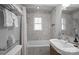 Updated bathroom with a bathtub, shower, and modern vanity at 2016 Winter St, Charlotte, NC 28205