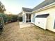 Landscaped backyard with a spacious patio and storage shed at 2022 Galena Chase Dr, Indian Trail, NC 28079