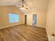 Main bedroom with hardwood floors and access to bathroom at 2022 Galena Chase Dr, Indian Trail, NC 28079