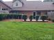 Brick home with a spacious backyard, patio, and lush lawn at 204 W 18Th St, Newton, NC 28658