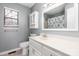 Updated bathroom with a white vanity and patterned shower curtain at 204 W 18Th St, Newton, NC 28658