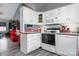 Well-equipped kitchen with white cabinets and a breakfast bar at 204 W 18Th St, Newton, NC 28658
