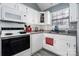 Modern kitchen with white cabinets and updated appliances at 204 W 18Th St, Newton, NC 28658