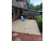 Large concrete patio with a blue Adirondack chair and landscaping at 204 W 18Th St, Newton, NC 28658