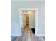 Bright hallway with light hardwood floors and access to laundry and other rooms at 209 Prospect Church Rd, Albemarle, NC 28001