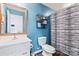 Clean bathroom with white vanity and blue walls at 2155 Galloway Ln, Concord, NC 28025