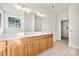 Double vanity bathroom with access to a walk-in closet at 3131 Pine Bluff Way, Fort Mill, SC 29707