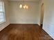 Bright dining room features hardwood floors and elegant wainscoting at 3131 Pine Bluff Way, Fort Mill, SC 29707