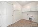 Functional laundry room with storage cabinets at 3131 Pine Bluff Way, Fort Mill, SC 29707