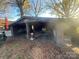 An open carport attached to the house, with a fire extinguisher visible at 3217 Howe Dairy Rd, Gastonia, NC 28056