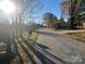 Residential street lined with trees and houses at 3217 Howe Dairy Rd, Gastonia, NC 28056