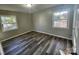 Bedroom with hardwood floors and large windows providing natural light at 3935 Amerigo St, Charlotte, NC 28208