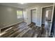 Bright bedroom with wood-look floors and ample closet space at 3935 Amerigo St, Charlotte, NC 28208