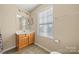 Bathroom with wood vanity and shower/tub at 413 Landis Oak Way, Landis, NC 28088