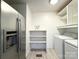 Laundry room with washer, dryer, and shelving at 6719 Paloverde Ln, Charlotte, NC 28227