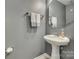 Clean bathroom with pedestal sink and gray walls at 8140 Haviland Ln, Fort Mill, SC 29707