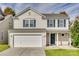 Two-story house featuring a neutral color scheme and a two-car garage at 8140 Haviland Ln, Fort Mill, SC 29707