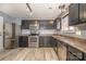 Modern kitchen with stainless steel appliances and dark wood cabinets at 8140 Haviland Ln, Fort Mill, SC 29707