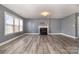 Spacious living room with fireplace and wood-look floors at 8140 Haviland Ln, Fort Mill, SC 29707