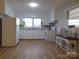 Bright kitchen with white cabinets, new flooring, and stainless steel appliances at 8600 E Highway 74 E Hwy, Marshville, NC 28103