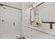 Modern bathroom with double vanity, marble shower, and large mirror at 9712 Lawing School Rd, Charlotte, NC 28214