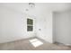 Well-lit bedroom with carpet flooring and double door closet at 9716 Lawing School Rd, Charlotte, NC 28214