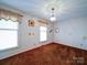 Inviting bedroom featuring carpet, window, and neutral tones at 1120 Jug Broome Rd, Monroe, NC 28112