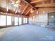 Sunroom with vaulted wood ceiling, windows, and ceiling fans at 1120 Jug Broome Rd, Monroe, NC 28112