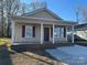 Tan colored siding and a covered front porch at 1136 Carolina Avenue Ext, Rock Hill, SC 29730