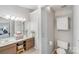 Double vanity bathroom with a toilet and linen storage at 12619 Ivey Creek Dr, Charlotte, NC 28273