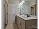 Double vanity bathroom with updated fixtures and flooring at 1426 Porch Wisdom Ct, Fort Mill, SC 29708