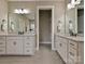 Double vanity bathroom with white cabinets and quartz counters at 1426 Porch Wisdom Ct, Fort Mill, SC 29708