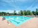 Community swimming pool with plenty of lounge chairs at 1426 Porch Wisdom Ct, Fort Mill, SC 29708