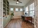 Home office with built-in shelving and hardwood floors at 1426 Porch Wisdom Ct, Fort Mill, SC 29708