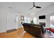 Living room with vaulted ceiling, fireplace, and hardwood floors at 2005 Wilson Ave, Monroe, NC 28110