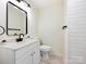 Bathroom with white vanity, black fixtures, and subway tile shower at 2013 Lilly Pond Ct, Charlotte, NC 28273