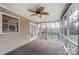 Cozy screened porch with ceiling fan and access to backyard at 3040 Wagonwheel Ct, Belmont, NC 28012