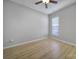 Light grey bedroom with hardwood floors and ceiling fan at 3094 Azalea Dr, Fort Mill, SC 29707