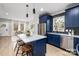 Modern kitchen with blue cabinetry, stainless steel appliances, and granite countertops at 310 Town St, Landis, NC 28088