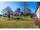 Large backyard with mature trees and shed at 4115 Conley St, Newton, NC 28658