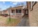 Brick front porch with a white railing and lamp post at 618 Lake Dr, Rockwell, NC 28138