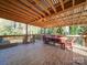 Relaxing deck with wooden pergola and outdoor dining set at 816 Applegate Ct, Gastonia, NC 28054