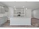 Modern kitchen with gray cabinets, granite countertops, and stainless steel appliances at 8216 Stonemere Ln, Charlotte, NC 28215