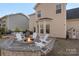 Stone firepit and seating area in backyard at 8436 Whitehawk Hill Rd, Waxhaw, NC 28173