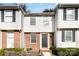 Brick front of a townhome with a small front yard at 9432 Lexington Cir # E, Charlotte, NC 28213